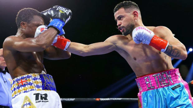 Robeisy 'El Tren' Ramirez (R) beats Isaac Dogboe (L) to win the featherweight world championship early this year.  The Cuban, Ramirez will defend his title against the unbeaten Mexican contender Espinoza on December 9th in Florida. MIKEY WILLIAMS TOP RANK. 